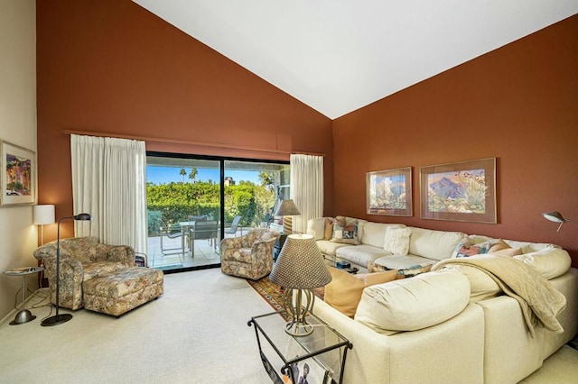 living room featuring carpet floors and high vaulted ceiling