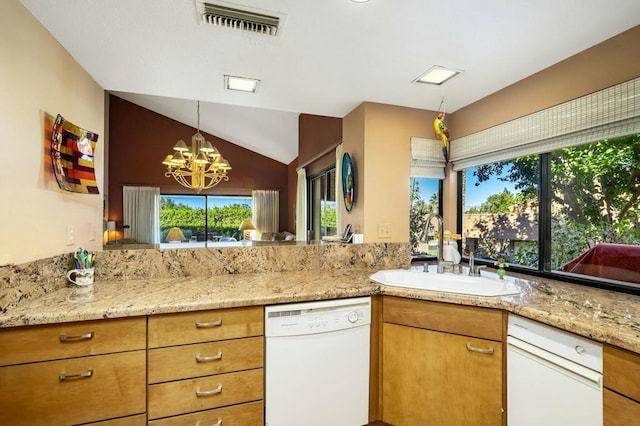 kitchen featuring kitchen peninsula, vaulted ceiling, sink, a notable chandelier, and dishwasher