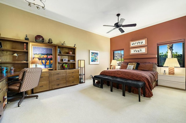 bedroom with carpet flooring, ceiling fan, and crown molding