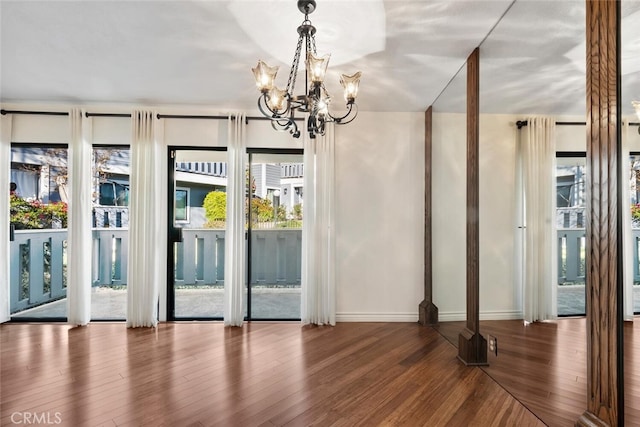 29121 Thousand Oaks Blvd Unit C, Agoura Hills, CA 91301 - unfurnished dining area with a chandelier, wood finished floors, and baseboards