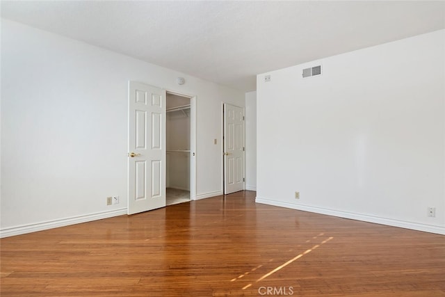 29121 Thousand Oaks Blvd Unit C, Agoura Hills, CA 91301 - unfurnished bedroom featuring wood finished floors, baseboards, a walk in closet, and a closet