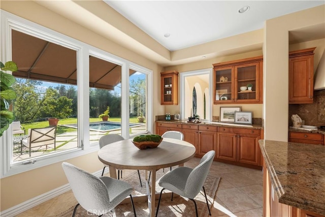 tiled dining area featuring a wealth of natural light