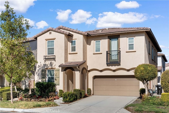 mediterranean / spanish-style house featuring a garage