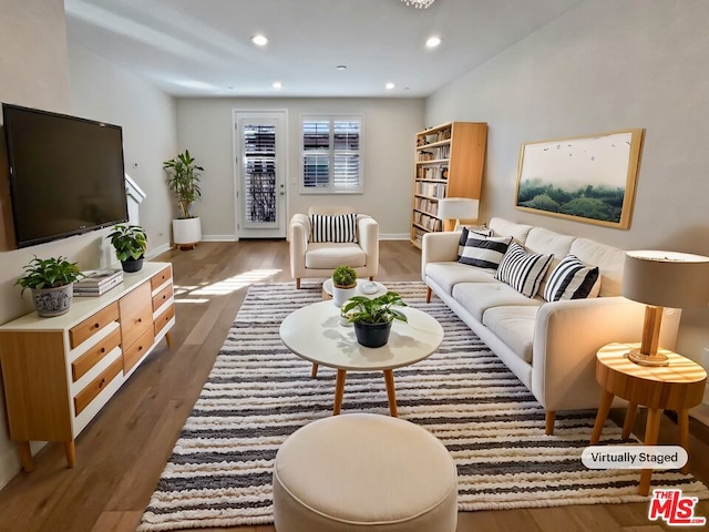 living room with dark hardwood / wood-style flooring