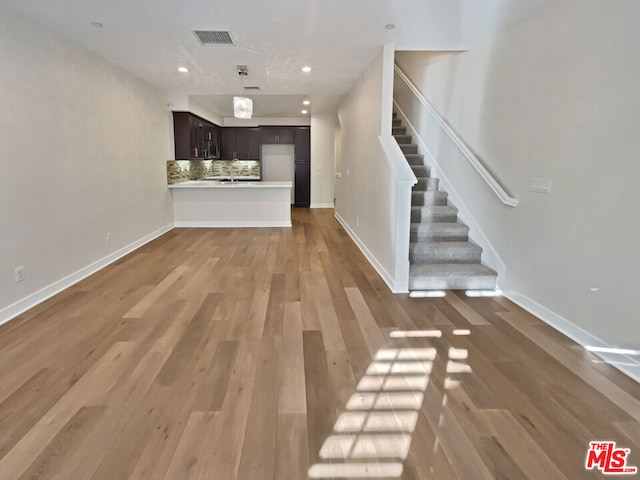 unfurnished living room with light wood-type flooring