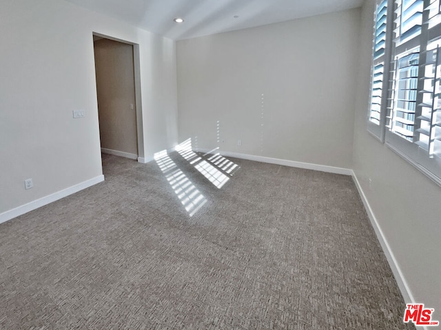 spare room with carpet