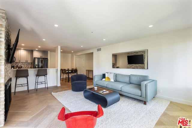 living room with light parquet floors