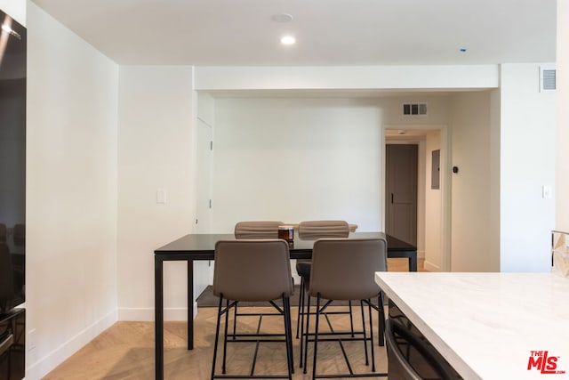 dining space featuring light hardwood / wood-style floors