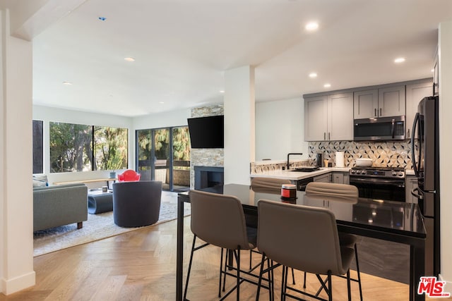 dining room featuring light parquet floors and sink