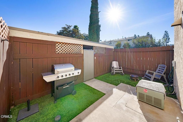 view of yard featuring a patio and a fenced backyard