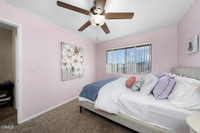 bedroom with a ceiling fan, baseboards, and carpet floors