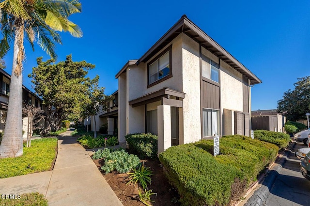 view of side of home featuring stucco siding