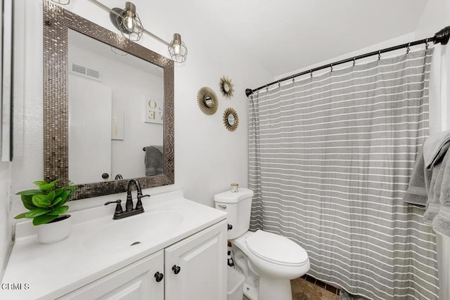 full bath with visible vents, toilet, and vanity