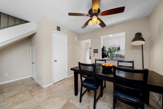 dining area featuring a ceiling fan, light tile patterned floors, baseboards, and visible vents