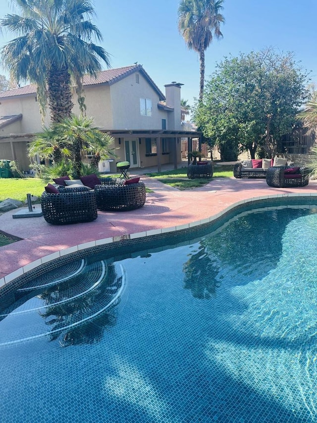 view of pool with a patio area