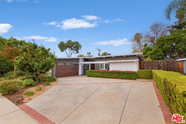 single story home featuring a garage