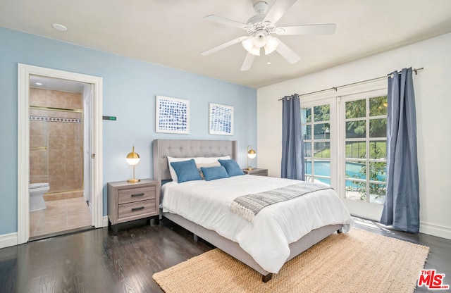 bedroom featuring ensuite bathroom, ceiling fan, and dark wood-type flooring