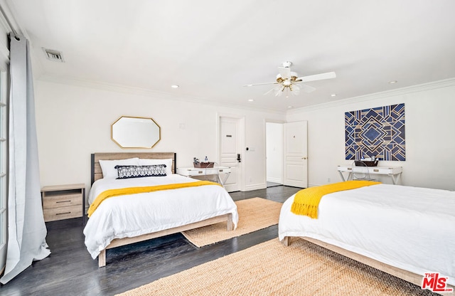 bedroom with ceiling fan, dark wood-type flooring, and crown molding