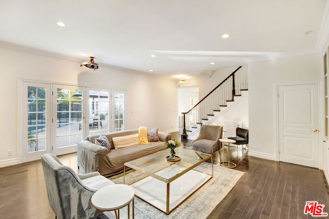 living room with dark wood-type flooring, french doors, and crown molding