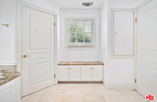 mudroom featuring light tile patterned flooring