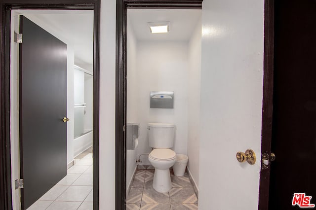 bathroom featuring tile patterned flooring and toilet