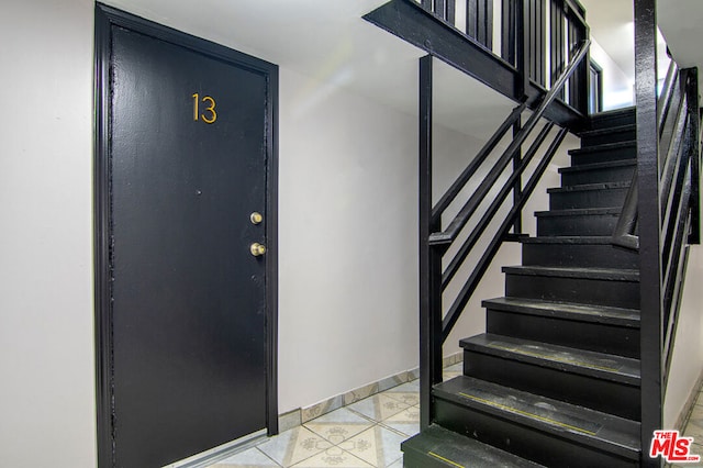 view of tiled foyer entrance