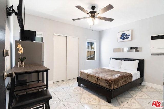 bedroom featuring ceiling fan and a closet