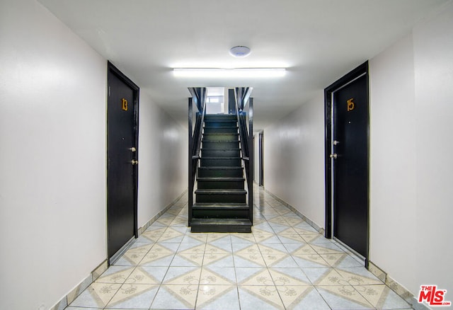 stairway featuring tile patterned floors