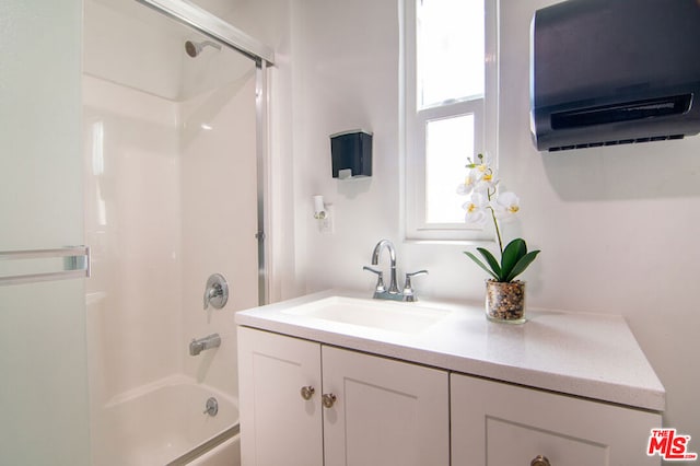 bathroom featuring bathing tub / shower combination and vanity