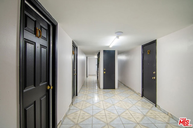 hallway with light tile patterned flooring