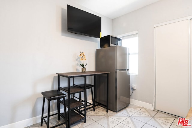 kitchen featuring stainless steel fridge