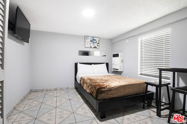 bedroom featuring a textured ceiling