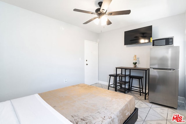 tiled bedroom featuring ceiling fan and stainless steel fridge