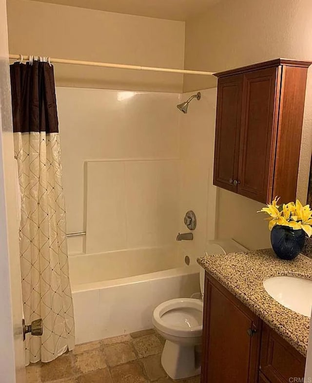 full bathroom featuring vanity, toilet, and shower / bathtub combination with curtain