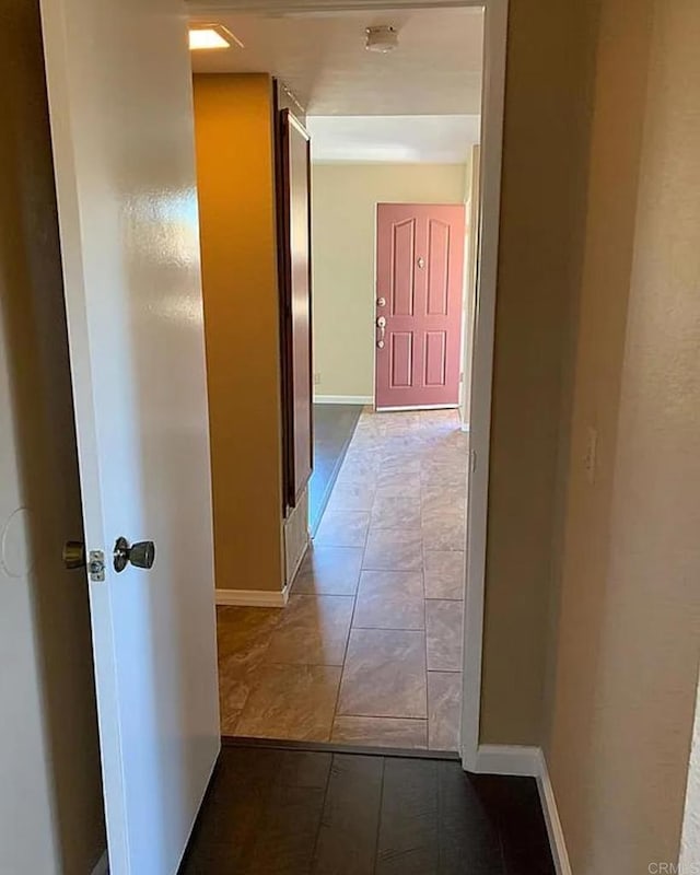 corridor featuring tile patterned flooring