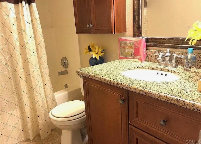 full bathroom with vanity, shower / bath combination with curtain, and toilet