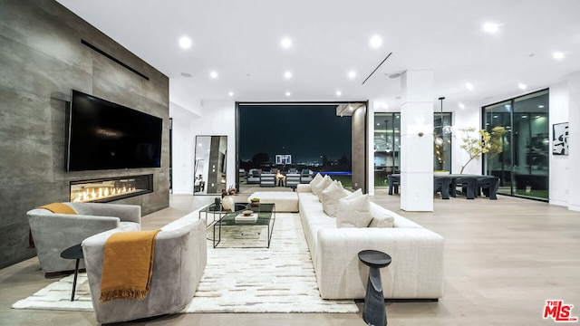 living room with a tiled fireplace