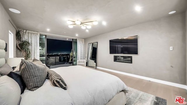 bedroom with hardwood / wood-style flooring