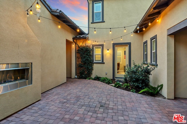 view of patio terrace at dusk