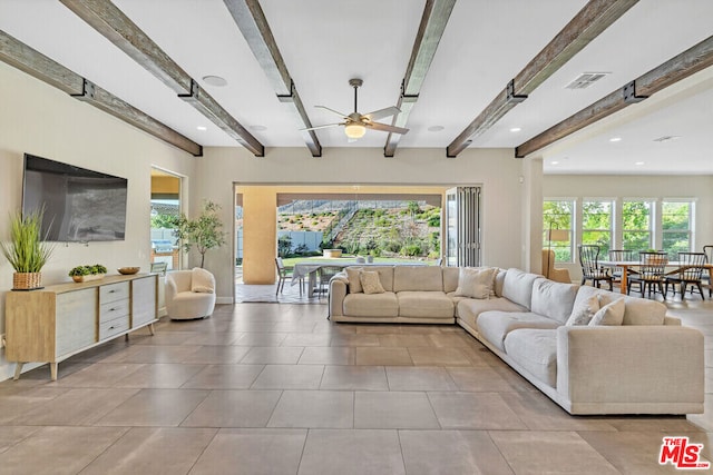 living room with beam ceiling and ceiling fan