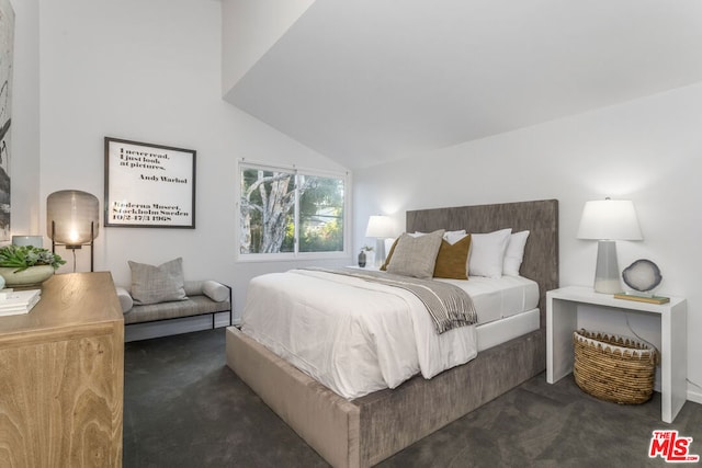 carpeted bedroom featuring vaulted ceiling