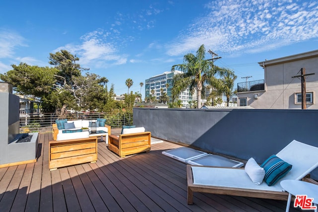 wooden deck featuring outdoor lounge area