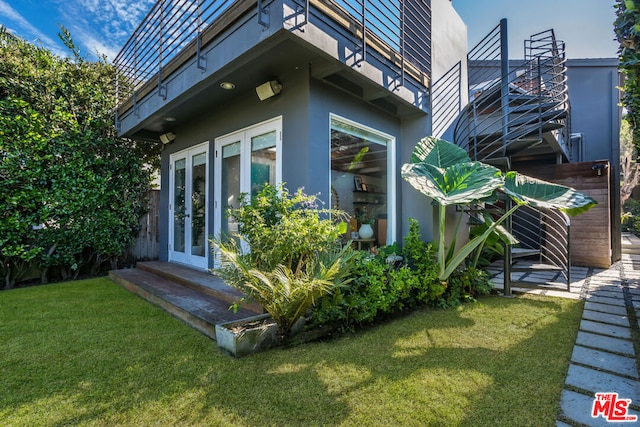 view of side of property with a lawn