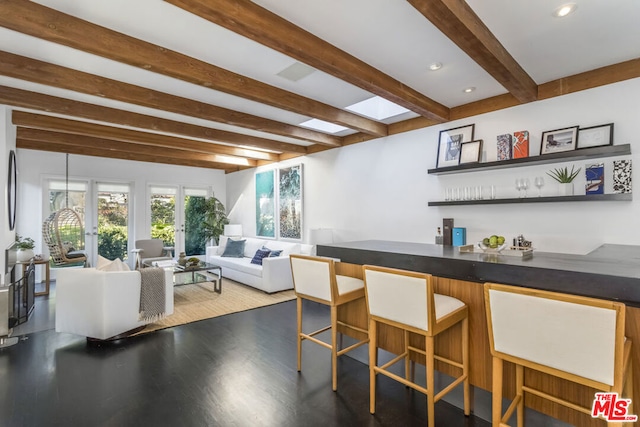 bar featuring beam ceiling and hardwood / wood-style floors