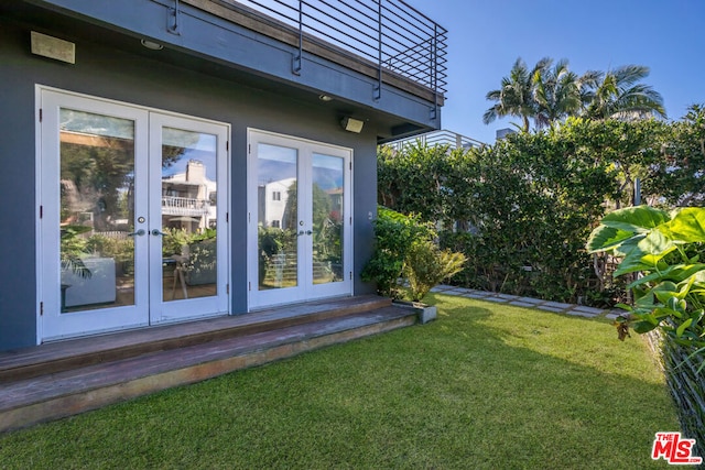 view of yard featuring french doors