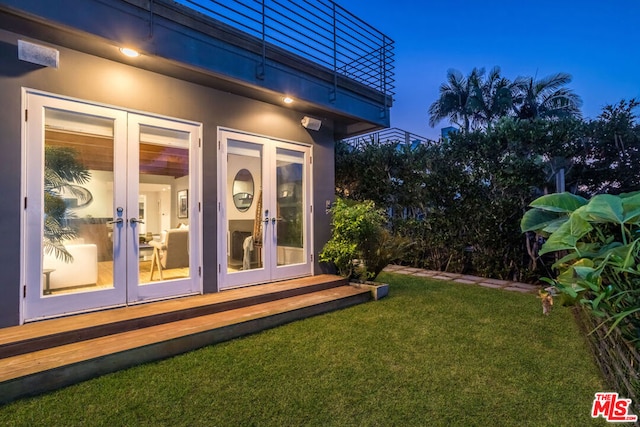 view of yard featuring french doors