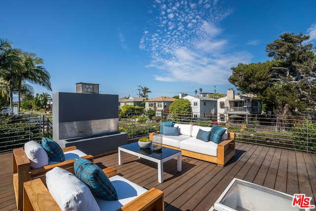 wooden deck featuring an outdoor living space