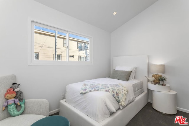 bedroom featuring vaulted ceiling