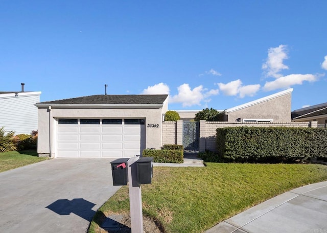 ranch-style home with a garage and a front lawn