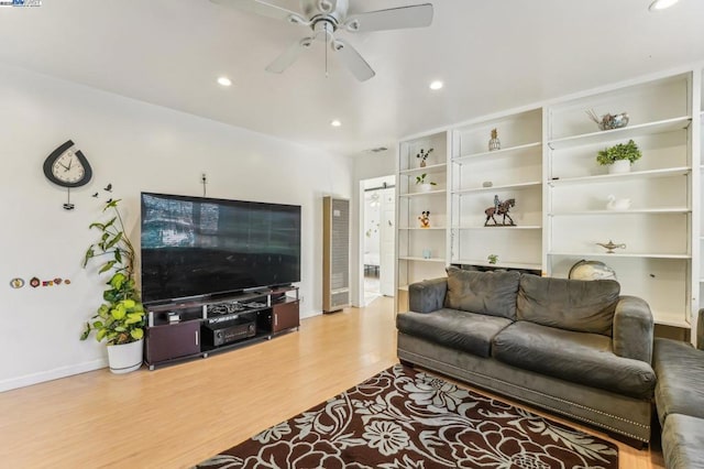 living room with ceiling fan and light wood-type flooring